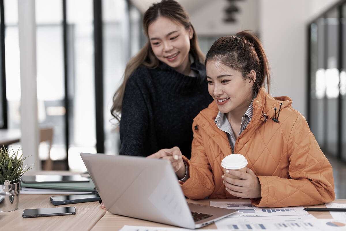 Two professionals collaborating in an office environment