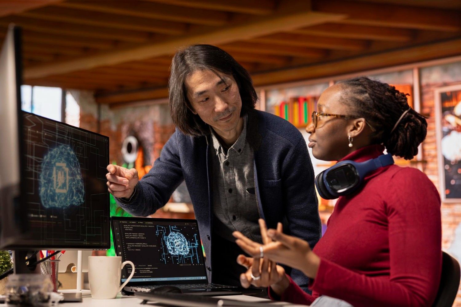 A senior manager assisting a worker in an AI software development agency.