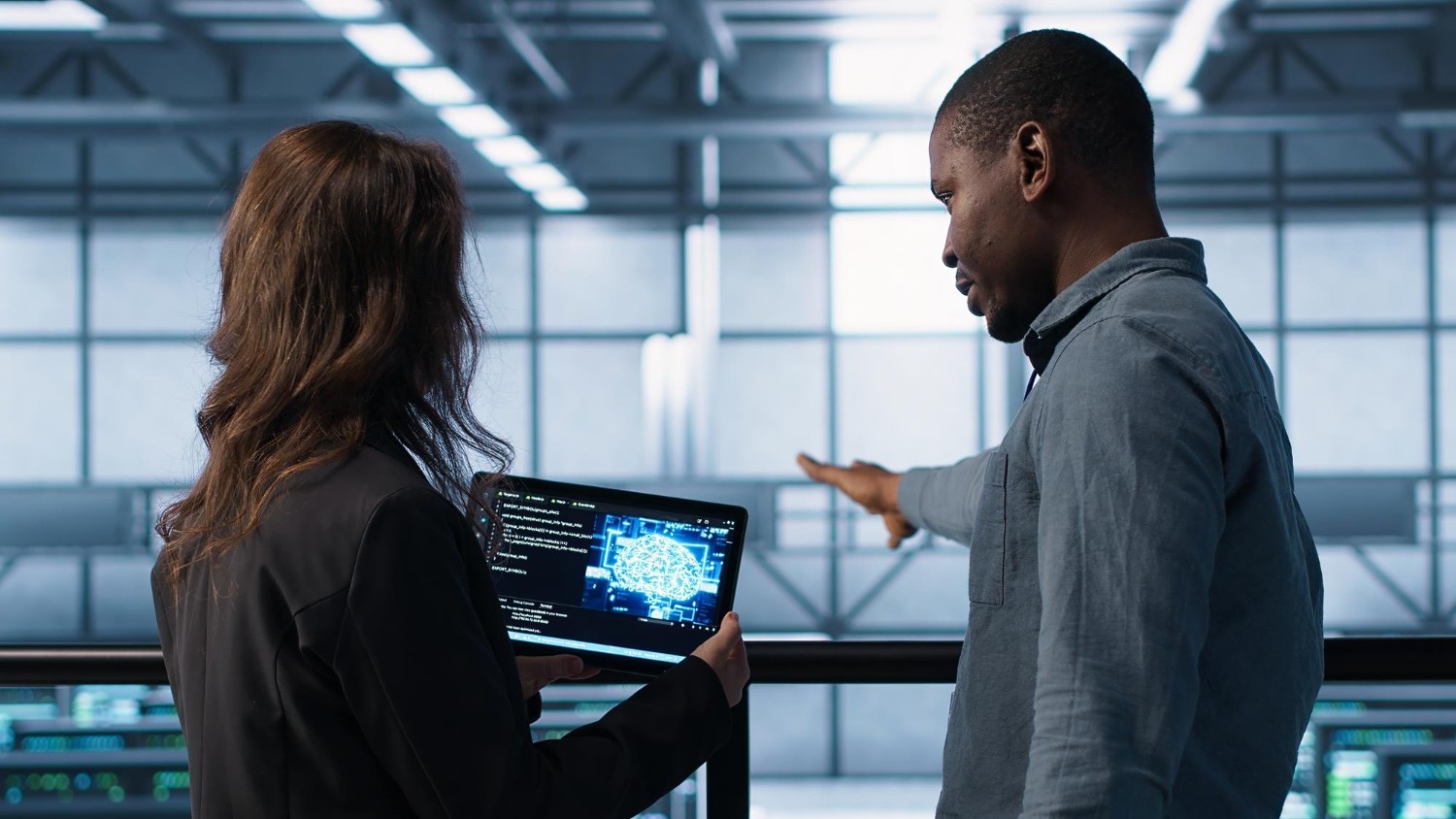 IT experts analyzing neural network on tablet