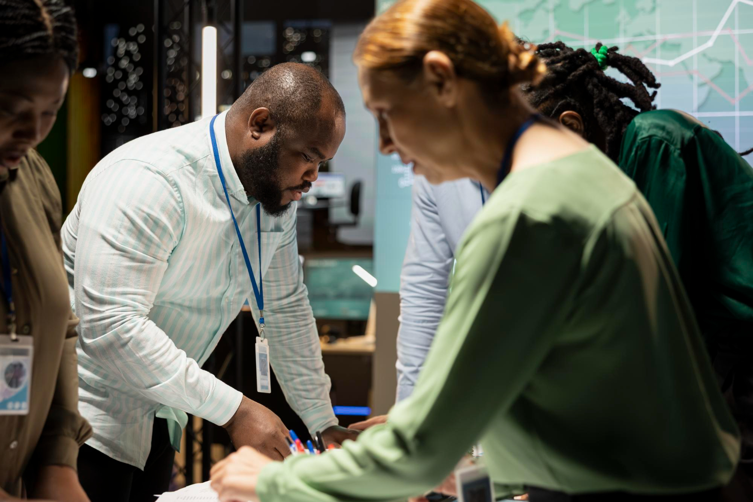 Diverse professional team collaborating at a workshop